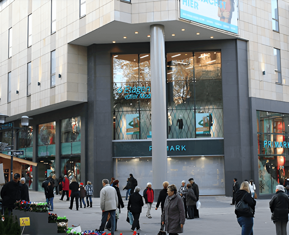 Shopping center entrance with natural stone cladding and glass panels